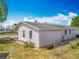 A serene side view of the home and its landscaping featuring a well maintained yard and mature plantings at 1236 Elkhart Cir, Tavares, FL 32778
