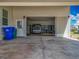 A peek inside the garage showcasing ample space for a car and storage at 1236 Elkhart Cir, Tavares, FL 32778