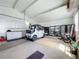 Well-lit garage with storage and room for multiple vehicles at 1236 Elkhart Cir, Tavares, FL 32778