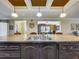 Kitchen island features a sink, dishwasher, and a view into the other living spaces at 1236 Elkhart Cir, Tavares, FL 32778