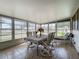 A well-lit lanai with a view of the neighborhood at 1236 Elkhart Cir, Tavares, FL 32778