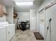 This laundry room includes built-in storage and workspace for added convenience at 1236 Elkhart Cir, Tavares, FL 32778