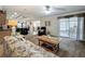 Inviting living area with seamless flow to the kitchen, comfortable seating, and outdoor access at 1236 Elkhart Cir, Tavares, FL 32778
