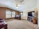 Relaxing living room featuring a built-in bar, comfortable seating, and ample natural light at 1236 Elkhart Cir, Tavares, FL 32778