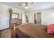 Comfortable main bedroom with neutral walls and a large dresser, plus an ensuite entrance at 1236 Elkhart Cir, Tavares, FL 32778