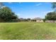 Spacious fenced backyard with a covered patio, great for outdoor activities and entertaining at 13336 Biscayne Dr, Grand Island, FL 32735
