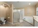 Bathroom featuring a corner tub and a separate glass-enclosed shower at 13336 Biscayne Dr, Grand Island, FL 32735