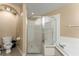 Bathroom featuring a corner tub and a separate glass-enclosed shower at 13336 Biscayne Dr, Grand Island, FL 32735