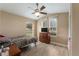 Cozy bedroom featuring wood floors, natural light, and a ceiling fan at 13336 Biscayne Dr, Grand Island, FL 32735