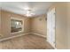 Cozy bedroom with wood-look floors and a large window at 13336 Biscayne Dr, Grand Island, FL 32735