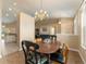Open concept view of dining room, living room, and kitchen in home with tile flooring at 13336 Biscayne Dr, Grand Island, FL 32735