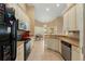 Kitchen with stainless steel appliances and breakfast nook at 13336 Biscayne Dr, Grand Island, FL 32735