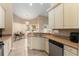 Kitchen featuring stainless appliances, adjacent breakfast nook, and wrap around countertop at 13336 Biscayne Dr, Grand Island, FL 32735