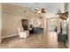 Spacious living room with tile floors, vaulted ceiling, fan, and natural light at 13336 Biscayne Dr, Grand Island, FL 32735