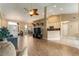 Open concept living room with tile flooring, vaulted ceilings, and seamless flow into dining area at 13336 Biscayne Dr, Grand Island, FL 32735