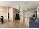 Spacious living area with tile floors, high ceilings, seamlessly blending into the dining space at 13336 Biscayne Dr, Grand Island, FL 32735