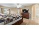 Comfortable main bedroom featuring a dresser, ensuite bath and backyard access at 13336 Biscayne Dr, Grand Island, FL 32735