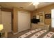 Neutral bedroom features a spacious closet, ceiling fan, and light wood grain floors at 1482 Azteca Loop, The Villages, FL 32162