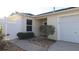 Close up view of a charming single-story home with an attached garage and gated entrance at 1482 Azteca Loop, The Villages, FL 32162