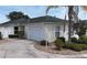 Well-maintained home featuring a two-car garage, mature landscaping, and a charming, quaint design at 1482 Azteca Loop, The Villages, FL 32162