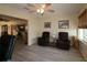 Inviting living room featuring neutral decor, comfortable seating, with natural light from the window for relaxing gatherings at 1482 Azteca Loop, The Villages, FL 32162