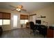 Comfortable office space featuring neutral decor, ample natural light, and a ceiling fan for a productive work environment at 1482 Azteca Loop, The Villages, FL 32162