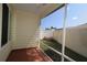 Screened patio with view of the backyard, yellow vinyl siding, and aluminum frame at 1482 Azteca Loop, The Villages, FL 32162