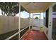 Screened patio with views of backyard, vinyl siding, painted floor, ceiling fan, and aluminum frame at 1482 Azteca Loop, The Villages, FL 32162