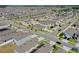 A neighborhood featuring single-Gathering homes with well-maintained streets and landscaping from an aerial perspective at 1548 Planters Point Rd, Kissimmee, FL 34744