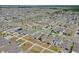 Expansive aerial view of a residential community with well-maintained streets, lawns, and numerous single-Gathering homes at 1548 Planters Point Rd, Kissimmee, FL 34744