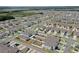 This is an aerial shot of a residential area in a suburban community with neatly arranged homes and green spaces at 1548 Planters Point Rd, Kissimmee, FL 34744