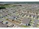 Overhead shot of neighborhood featuring single-Gathering homes and a community pool in the distance at 1548 Planters Point Rd, Kissimmee, FL 34744