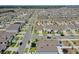 A residential community with a grid street pattern, featuring well-maintained homes and landscaped front yards at 1548 Planters Point Rd, Kissimmee, FL 34744
