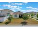 Back of the home with lawn, vinyl fence and screened in patio is well maintained and looks inviting at 1548 Planters Point Rd, Kissimmee, FL 34744
