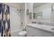 Neutral bathroom with shower-tub combo and modern vanity with brushed nickel faucet and decorative decor at 1548 Planters Point Rd, Kissimmee, FL 34744