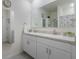 Bright bathroom with double sink vanity, neutral walls and tile flooring and a separate toilet area at 1548 Planters Point Rd, Kissimmee, FL 34744