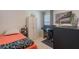 Comfortable bedroom with natural light, functional desk space, and ample storage with accent vase at 1548 Planters Point Rd, Kissimmee, FL 34744