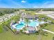 Spacious community pool complex includes sun loungers, a playground, and a recreational area at 1548 Planters Point Rd, Kissimmee, FL 34744