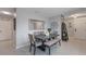 Open dining space featuring modern decor, tiled floors, gray walls and seating and stylish accents at 1548 Planters Point Rd, Kissimmee, FL 34744