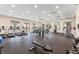Modern gym featuring treadmills, weight machines, and fitness equipment for resident use at 1548 Planters Point Rd, Kissimmee, FL 34744