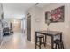 Inviting hallway featuring stylish decor, a dining table, and a view of the home's entrance at 1548 Planters Point Rd, Kissimmee, FL 34744