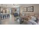 Spacious living area combining seating, dining, and kitchen spaces for modern living and entertaining at 1548 Planters Point Rd, Kissimmee, FL 34744
