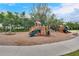 Community playground with slides, swings, and climbing structures for enjoyment at 1548 Planters Point Rd, Kissimmee, FL 34744