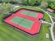Aerial view of community tennis courts surrounded by lush landscaping and pathways at 1548 Planters Point Rd, Kissimmee, FL 34744
