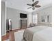 Bright bedroom with hard wood floors, a TV, a mirror and seating at 17471 Se 110Th Ter, Summerfield, FL 34491
