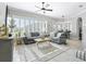 Bright living room with many windows offering plenty of sunlight at 17471 Se 110Th Ter, Summerfield, FL 34491
