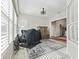 Bright sunroom with shuttered windows and open doorway at 17471 Se 110Th Ter, Summerfield, FL 34491