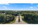 Beautiful aerial view of the tree-lined community and lush landscaping at 19627 Spring Oak Dr, Eustis, FL 32736
