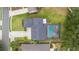 Aerial view of home with screened pool and well-maintained landscaping, in a desirable neighborhood at 19627 Spring Oak Dr, Eustis, FL 32736