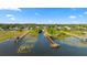 Picturesque waterfront community featuring docks and lush greenery, offering serene living at 19627 Spring Oak Dr, Eustis, FL 32736